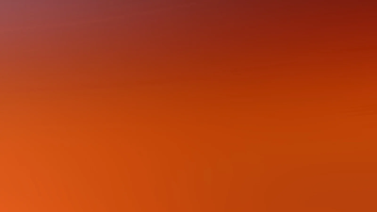 Weicher Farbverlauf von dunklem Rot oben rechts über Orangerot bis zu hellem Orange unten links, ohne erkennbare Motive.