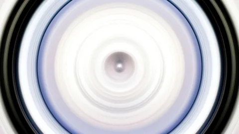 Abstrakte Aufnahme aus konzentrischen, radial verwischten Kreisen in Weiß, Hellblau und Schwarz mit hellem Zentrum