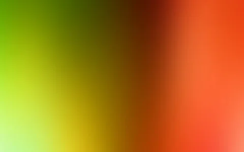 Unscharfer Farbverlauf von hellgrün über Gelb und Braun bis zu kräftigem Orange und Rot, diagonal von links nach rechts.