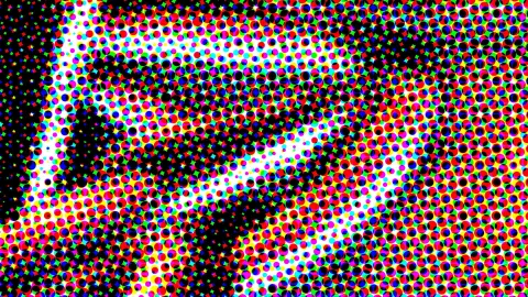 Dichtes Raster aus farbigen Punkten in Rot, Gelb, Grün, Blau und Magenta auf schwarzem Grund, in der Mitte zeichnet sich ein heller Umriss ab.