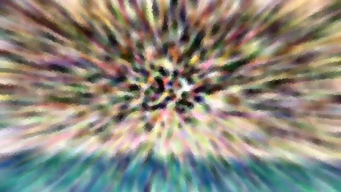 Abstraktes Bild mit bunten, radial verlaufenden Streifen aus kleinen Mosaiksteinen, die von einem dunklen Zentrum nach außen strahlen.