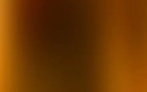 Weicher Farbverlauf in Orange und Braun, am Rand heller, in der Mitte dunkel und fast schwarz.