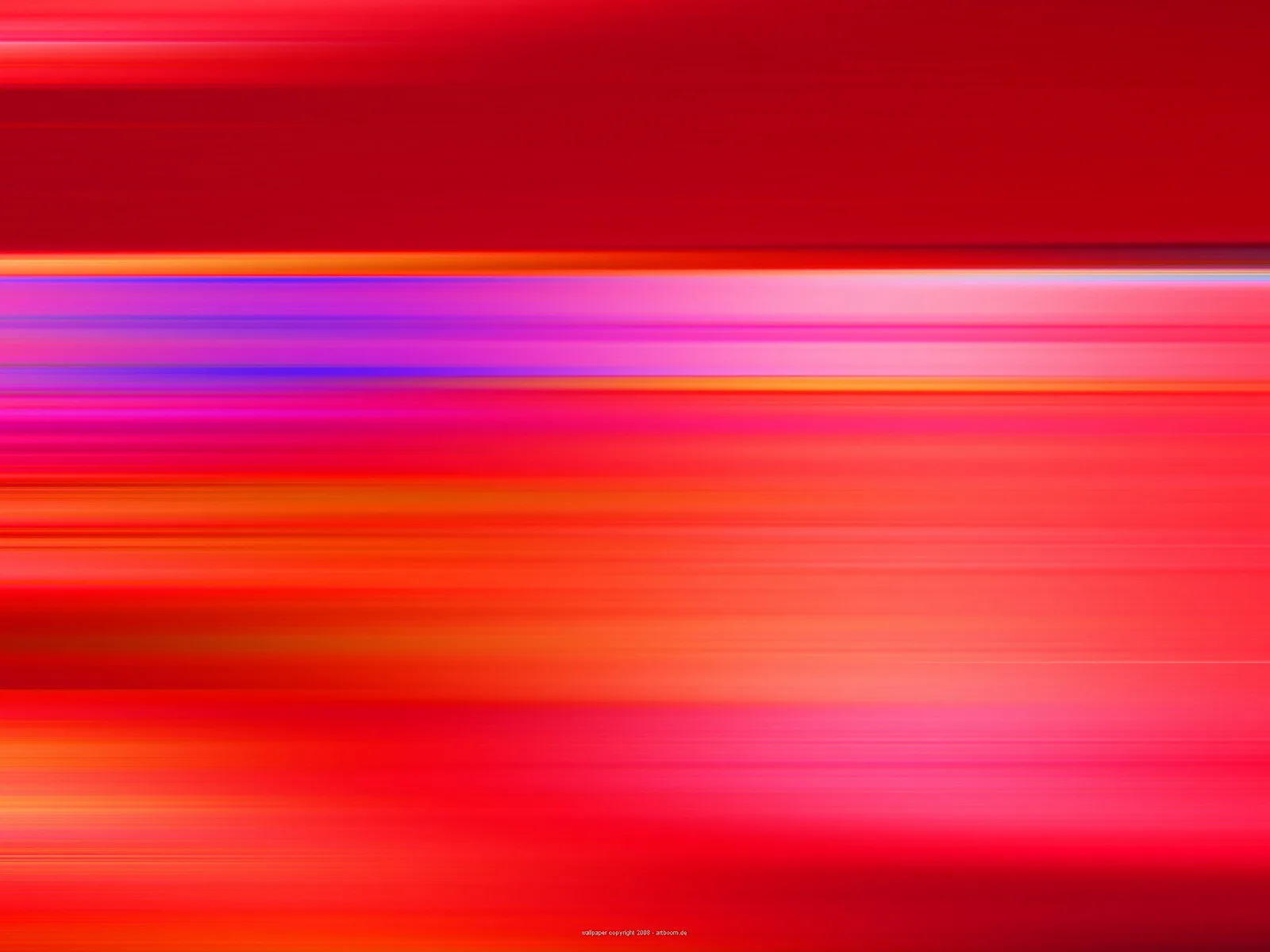 Horizontale, verwischte Streifen in Rot, Orange, Pink und Violett, die von links nach rechts ineinanderfließen.