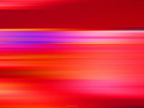 Horizontale, verwischte Streifen in Rot, Orange, Pink und Violett, die von links nach rechts ineinanderfließen.