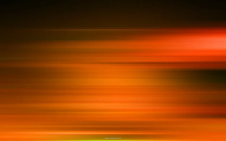 Horizontale, verwischte Streifen in Orange, Rot und Gelb vor dunklem Hintergrund, mit hellerem Leuchten rechts oben und einem dunklen Fleck rechts unten.