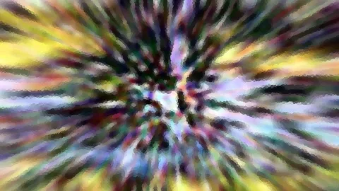 Abstraktes Bild mit radialen Streifen in Gelb, Violett, Grün und Blau, die von der Mitte nach außen laufen.