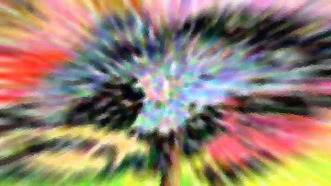 Abstraktes Bild mit radial von der Mitte nach außen verlaufenden Farbstrahlen in Rot, Gelb, Grün, Blau und Violett, die Mitte ist hell und bunt gesprenkelt.