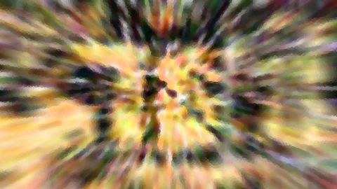 Abstrakte Komposition aus radial von der Mitte ausgehenden Farbstrahlen in Gelb, Orange und Grün, mit mosaikartiger Struktur.