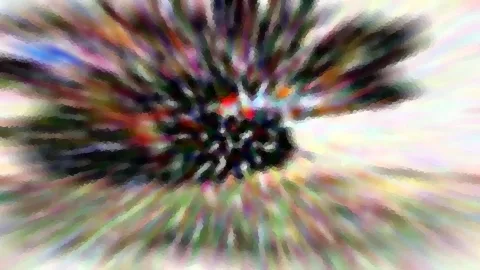 Abstrakte Komposition aus bunten, radial verlaufenden Schlieren um eine dunkle Mitte mit roten Akzenten