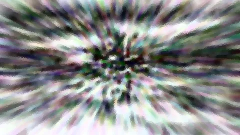 Abstraktes Bild mit radialer Bewegungsunschärfe, die von der Mitte nach außen verläuft. Farben sind Grün, Violett, Weiß und Schwarz in pixeligen Schlieren.