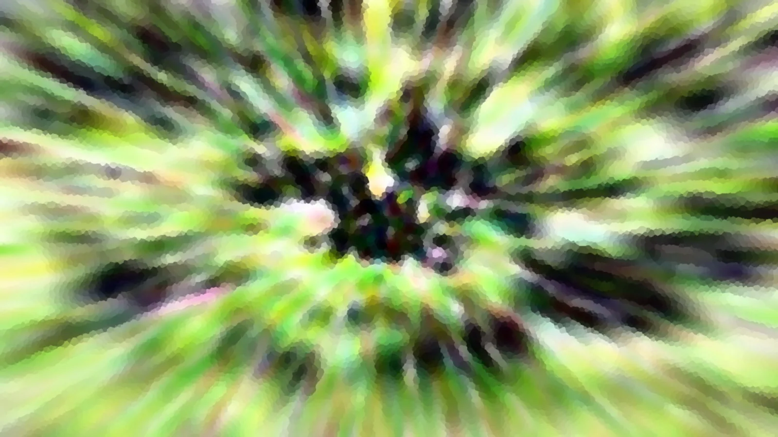 Stark verwischte, radial angeordnete Aufnahme von grünem Laub mit dunklem Zentrum und mosaikartiger Struktur