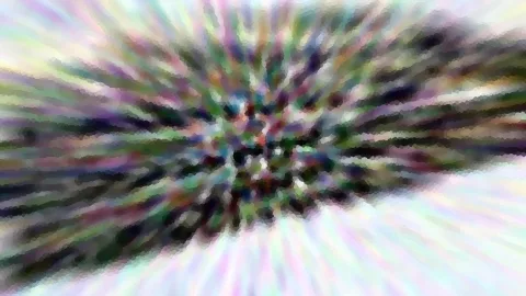 Abstraktes Bild aus bunten Farbstreifen, die radial von einem dunklen Zentrum nach außen laufen.