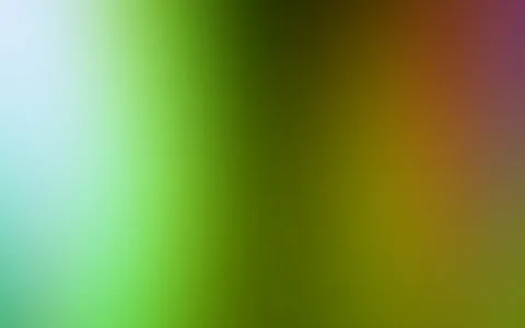 Weicher, unscharfer Farbverlauf von hellem Blau links über sattes Grün bis zu Orange und Violett rechts.