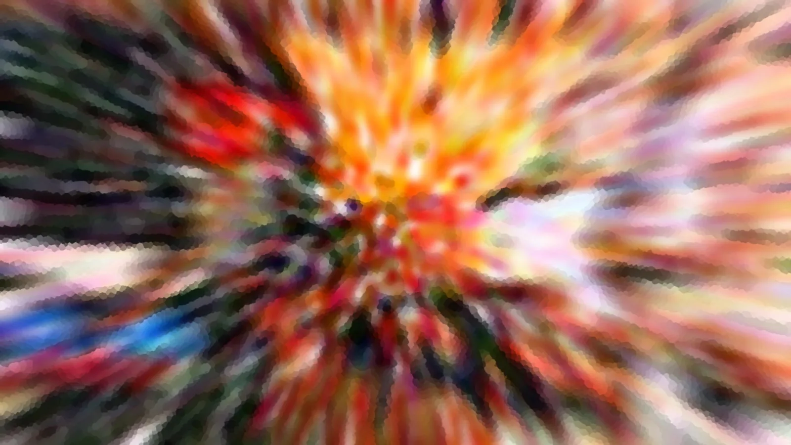 Abstrakte radiale Unschärfe mit orangen, roten, blauen und grünen Farbstreifen, die von einem hellen Zentrum nach außen laufen.