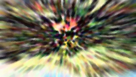 Abstrakte, radial verwischte Farbfläche mit Rot, Gelb und Grün, die von einem hellen Zentrum nach außen strahlt.