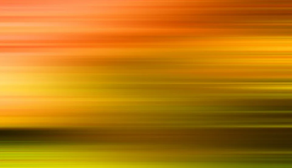 Abstrakte, horizontal verwischte Streifen in Orange, Gelb und Grün, die von oben nach unten ineinander übergehen.