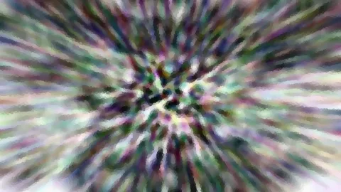 Abstraktes Bild mit bunten, unscharfen Streifen, die von einem zentralen Punkt nach außen strahlen, grob gerastert wie ein Mosaik.