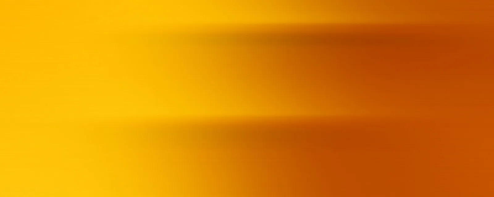 Horizontale, unscharfe Streifen in Gelb und Orange, die von links hell nach rechts dunkler verlaufen.