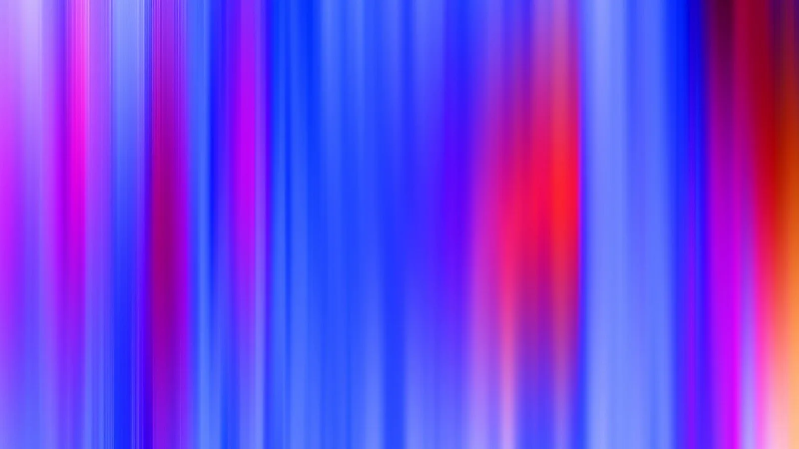 Abstrakte vertikale Schlieren in Blau, Violett und Rot, die wie Bewegungsunschärfe von links nach rechts verlaufen.