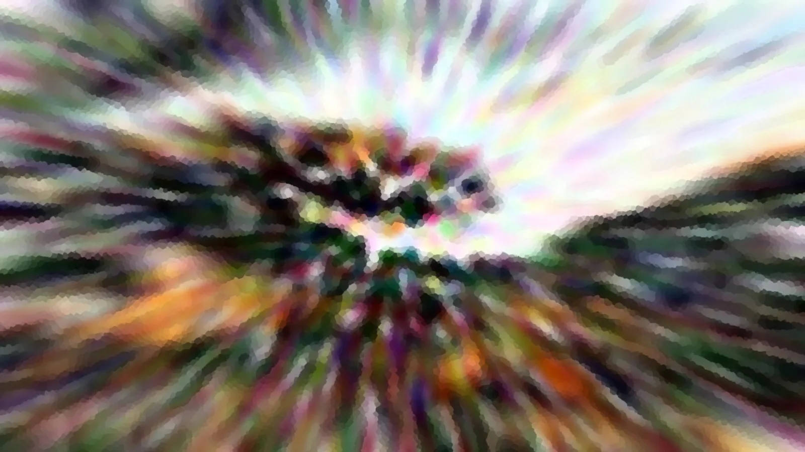 Abstrakte, farbige Radialunschärfe mit grob gepixelten Strahlen um einen dunklen, verschwommenen Mittelpunkt.