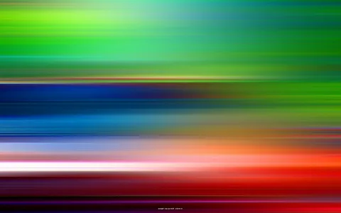 Horizontal verwischte Streifen in Grün, Blau, Orange und Rot, die von oben nach unten ineinander übergehen, mit einer weißen Lichtlinie in der unteren Hälfte.