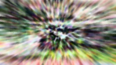 Abstraktes Bild mit radialem Zoomeffekt in Grün, Rosa und Violett, die von einem dunklen Zentrum nach außen strahlen, grob gerastert.