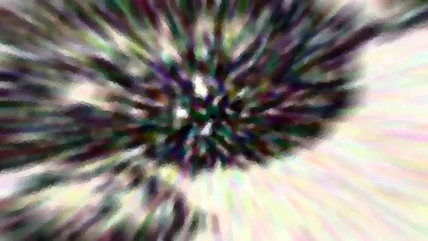 Abstraktes Bild mit radialen, verwischten Farbstreifen in Grün, Violett und Weiß, die von einem dunklen Zentrum nach außen laufen.
