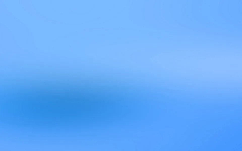 Weich verlaufende Fläche in Blau: oben und rechts hell, links unten ein dunklerer, unscharfer Schatten.