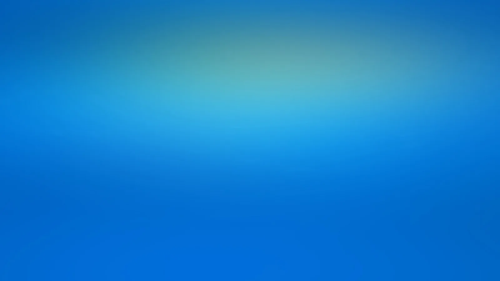Unscharfer blauer Farbverlauf, oben in der Mitte mit hellem türkisfarbenem Lichtschein.