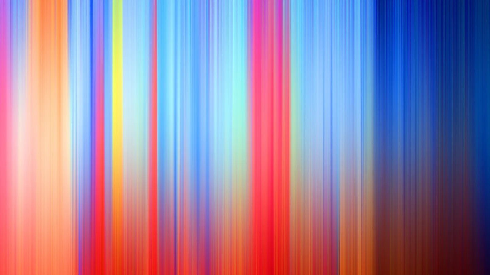 Vertikal verwischte Streifen in Rot, Orange, Gelb, Blau und Violett, die von hell nach dunkel verlaufen