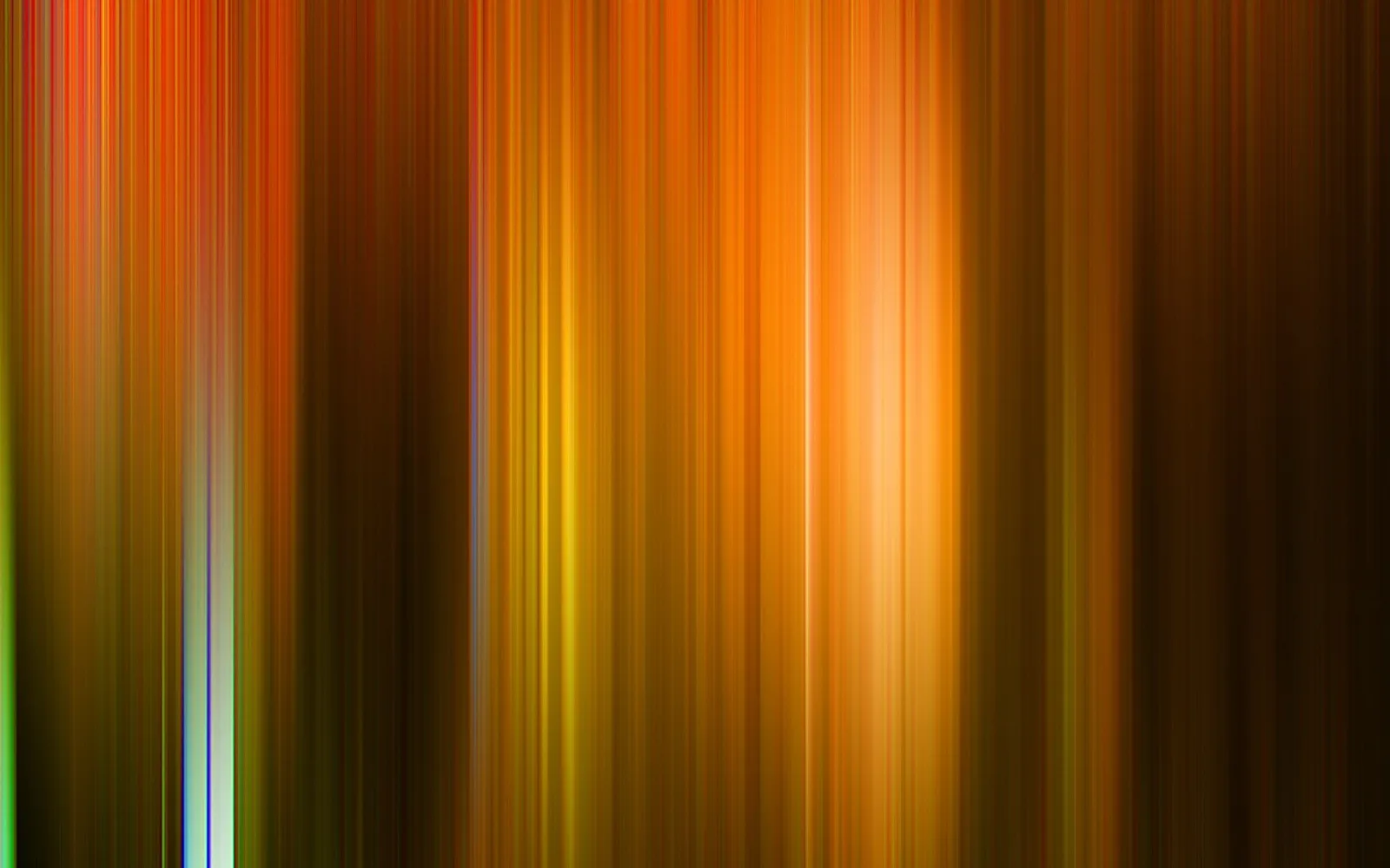 Abstraktes Bild aus vertikalen, unscharfen Streifen in Orange, Braun und Gelb, in der Mitte leuchtet ein heller Lichtbereich.