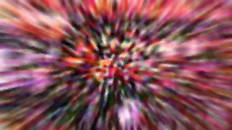 Abstrakte, farbige Zoom-Unschärfe mit radialen Streifen, die von einem hellen Zentrum nach außen laufen.