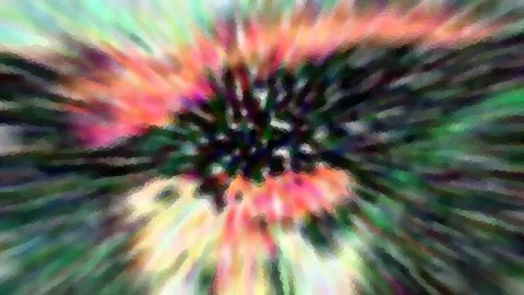 Abstraktes Bild mit radialem Bewegungsunschärfe-Effekt: farbige Streifen in Pink, Grün und Gelb laufen von einem dunklen Zentrum nach außen.