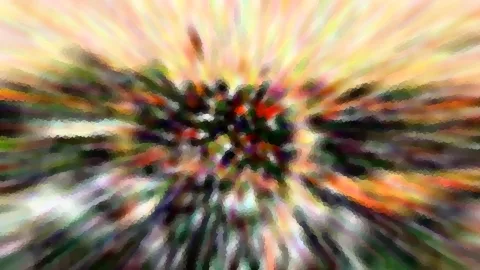 Abstraktes Bild mit bunten Farbstrahlen, die von einem dunklen, dichten Zentrum nach außen laufen, grob gepixelt und verwischt.