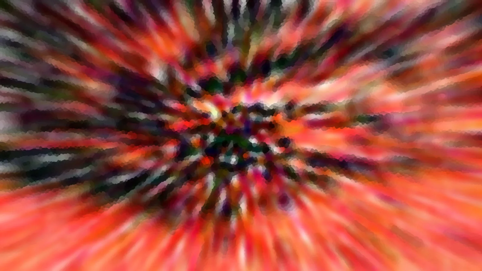 Abstraktes Bild mit radial von der Mitte nach außen verlaufenden Farbstrahlen in Rot, Orange, Schwarz und Weiß, verwischt wie bei einer Zoomfahrt.