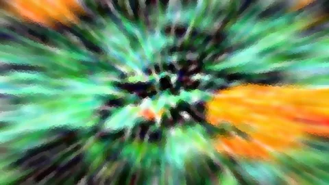 Abstraktes Bild mit radialer Unschärfe: grüne und türkisfarbene Streifen laufen auf eine dunkle Mitte zu, rechts leuchtet ein orangefarbener Bereich.
