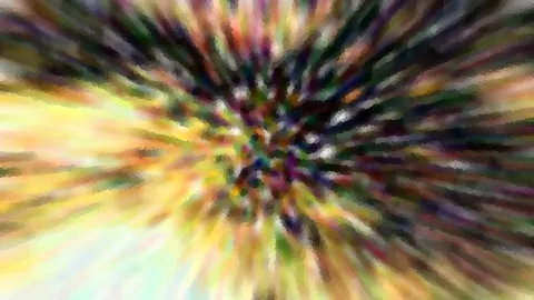 Abstraktes Bild mit farbigen Streifen in Gelb, Grün, Lila und Schwarz, die von einem Mittelpunkt nach außen strahlen. Die Kanten wirken blockartig pixelig.