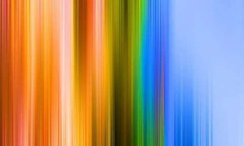 Vertikal verwischte Streifen in Orange, Gelb, Grün, Blau und Hellblau, die von links nach rechts ineinander übergehen.