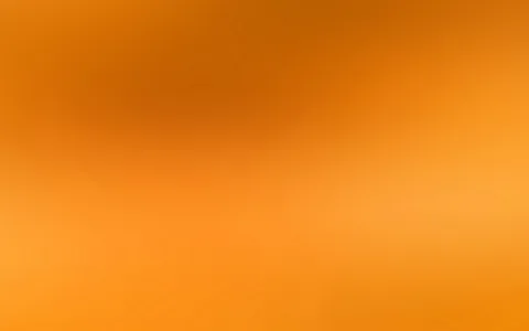 Weicher Verlauf von dunklerem Orange oben links zu hellem Orange unten rechts, ohne erkennbare Formen.