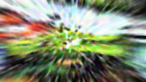 Abstraktes Bild mit radialem Zoomeffekt in Grün, Rot und Weiß, die Farbstreifen laufen von einem hellen Zentrum nach außen.
