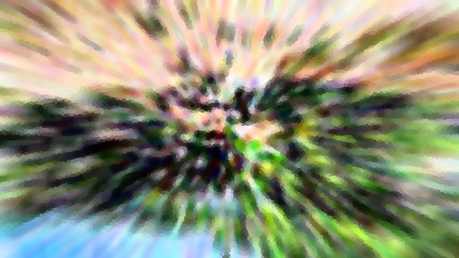 Abstrakte Zoomunschärfe mit grünen, rosa und gelben Farbstrahlen, die von der Mitte nach außen laufen, unten ein blasser blauer Himmel.