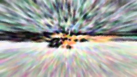 Abstrakte Komposition aus bunten Farbstrahlen, die von einem dunklen Zentrum mit orangefarbenem Schimmer nach außen laufen, grob gepixelt und mit einem hellen Horizontstreifen.
