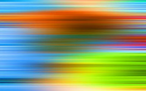 Horizontal verwischte Farbstreifen in Blau, Orange, Gelb und Grün.