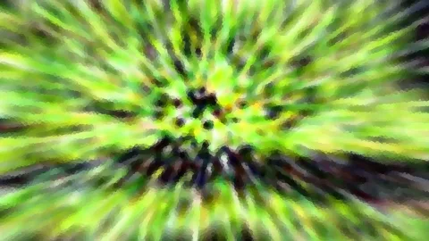 Abstrakte Aufnahme mit grünen und gelben Farbstreifen, die von einem dunklen Zentrum radial nach außen laufen, leicht mosaikartig pixelig.