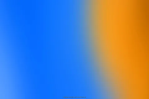 Weich verlaufender Farbverlauf: links dominiert kräftiges Blau, rechts geht es über einen unscharfen Übergang in warmes Orange.