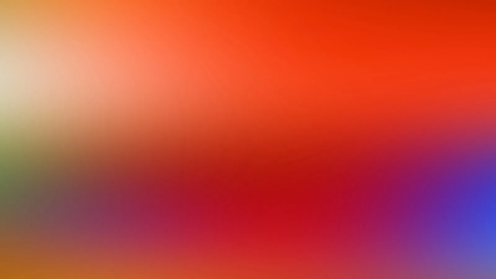Unscharfer Farbverlauf von Orange und Rot über Gelb und Grün bis zu Blau am rechten Rand