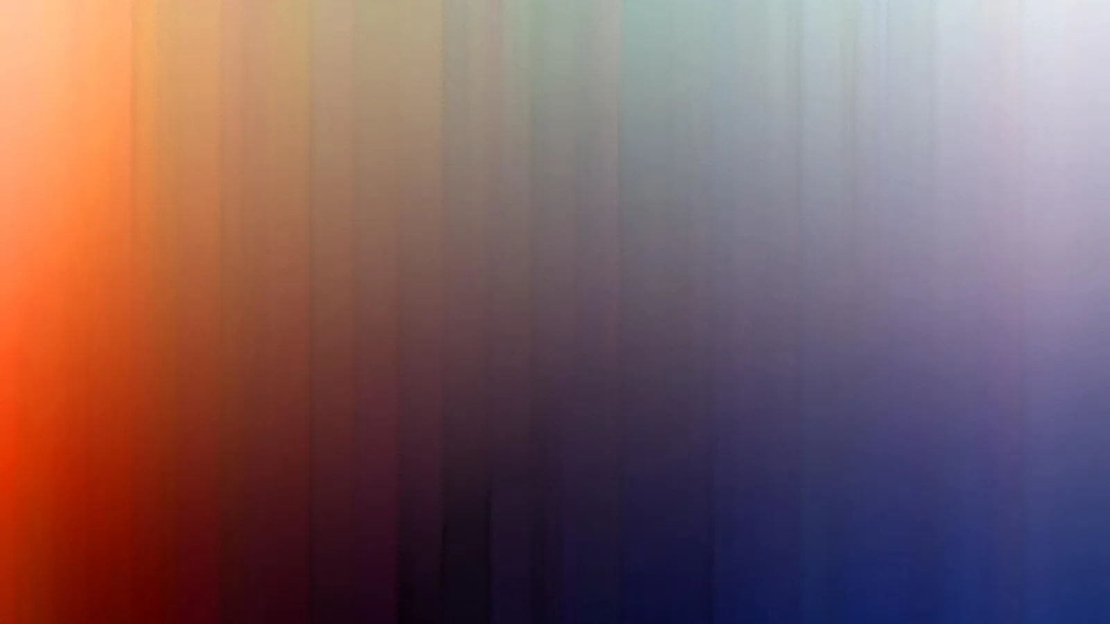 Abstrakter, vertikal verlaufender Farbverlauf: links leuchtendes Orange, in der Mitte dunkles Violett und rechts Blau mit hellen Akzenten oben rechts.