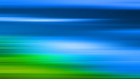 Horizontal verwischte Lichtstreifen, oben dunkelblau, unten grün, mit einem hellen Schimmer in der Bildmitte.
