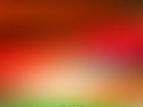 Unscharfer Farbverlauf von dunklem Rotbraun oben über Rot und Orange bis zu hellem Beige und Grün am unteren Rand.
