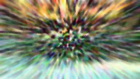 Abstrakte Komposition aus bunten Strahlen, die von einem dichten Zentrum nach außen laufen, mosaikartig gepixelt.